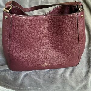Kate Spade Like New Maroon purse. Very lightly used. Excellent condition.